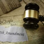Gavel on 14th Amendment document with Constitution