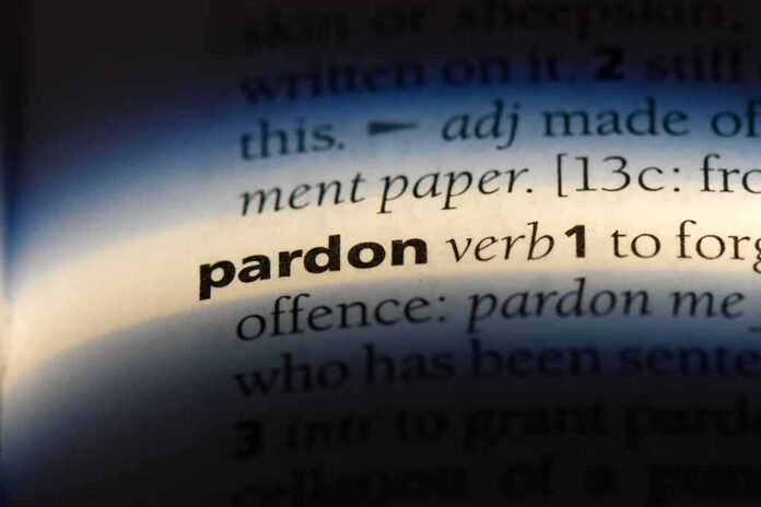1155434380 featured image The word pardon highlighted in a dictionary.