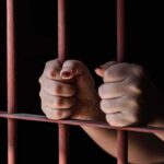 Horror in a Mexican Jail – 2 Americans Unmercilessly Trapped Hands gripping metal prison bars tightly