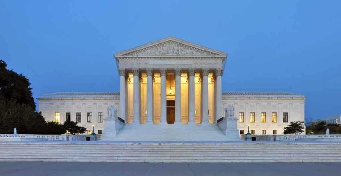 135286625 featured image Large neoclassical building with illuminated columns at dusk