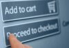 Finger tapping proceed to checkout button online