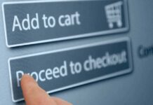 Finger tapping proceed to checkout button online