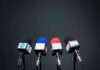 Microphones set up for a news conference