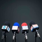 Microphones set up for a news conference