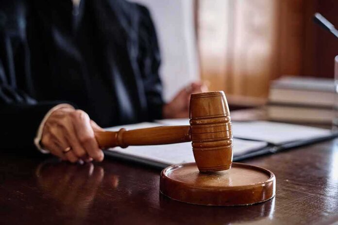 2378803063 featured image Judge holding gavel in courtroom