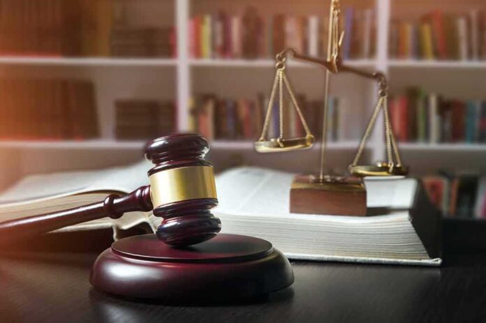 648441076 featured image Gavel and scales of justice on book