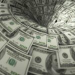 Hundred-dollar bills swirling into a financial vortex