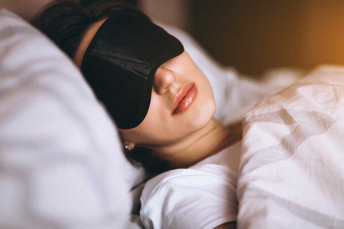 1057510142 featured image Woman sleeping with eye mask on bed