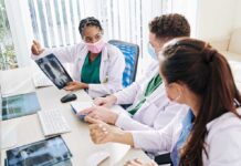 Doctors discussing a chest X-ray image