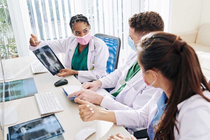 Doctors discussing a chest X-ray image