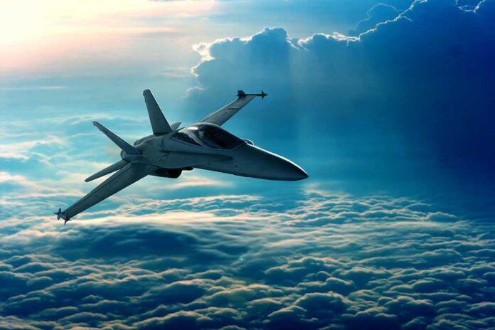 Jet flying above clouds in blue sky