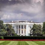White House front view with dark clouds above