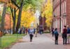 People walking on a college campus in autumn