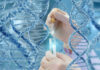 Hands with pipette and test tube surrounded by DNA strands