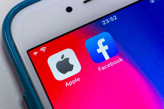 Apple and Facebook apps on smartphone screen