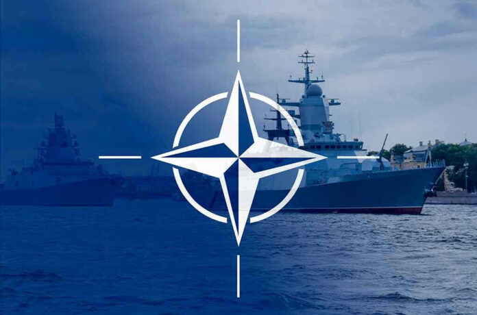 2113634360 Navy ships with NATO logo overlay