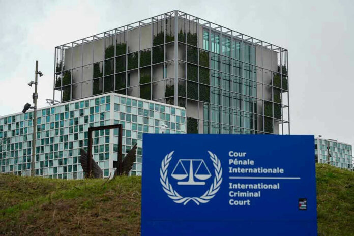 2412227789 International Criminal Court building with sign in foreground