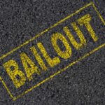 Catch-And-Release Fury Erupts Amid Viral Assault Yellow 'BAILOUT' text marked on a black asphalt surface