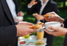 Professionals enjoying refreshments at an outdoor event