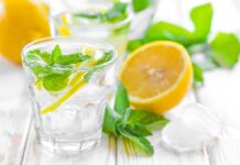 Doctors Stunned as SIMPLE Hack Supercharges Tea A refreshing drink with lemon slices and mint leaves in a clear glass