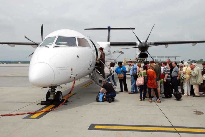 shutterstock_58311700.jpg Passengers boarding a small aircraft at an airport