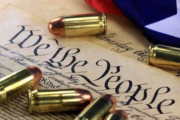 shutterstock_170423123.jpg Close-up of bullets surrounding a historical document with the phrase We the People
