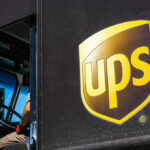 UPS delivery truck with driver inside cab
