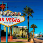 Casino Empire Shake-Up: $1.16B Deal Stuns Vegas Welcome to Fabulous Las Vegas sign, daytime.