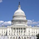 The U.S. Capitol building under a clear blue sky