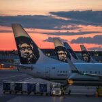 Bomb Threat Halts Airport – ALL Flights GROUNDED! Airplanes with Alaska Airlines branding at sunset