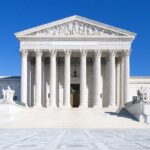 SCOTUS STRIPS Major Requirement From U.S Passports The Supreme Court building featuring marble columns and a clear blue sky