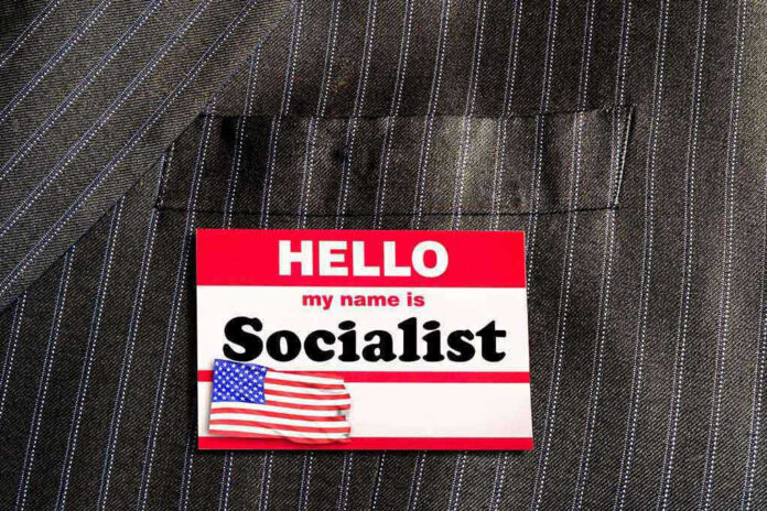 Hello my name is Socialist name tag on suit.