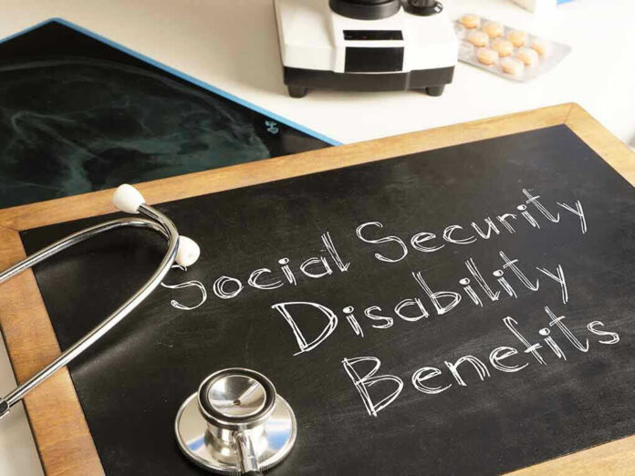 Stethoscope and chalkboard saying Social Security Disability Benefits.
