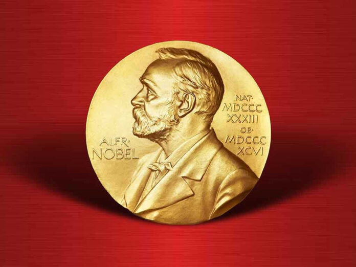 521945908 Gold Nobel Prize medal on red background.