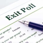 Close-up of an exit poll survey form with a pen