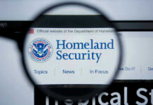 Whistleblower EXPOSES 4,500 Federal Agents – Massive Leak! Magnifying glass showing Homeland Security website.