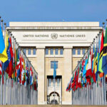 Somali Ambassador’s Secret Business Exploit Exposed United Nations building with numerous national flags outside.