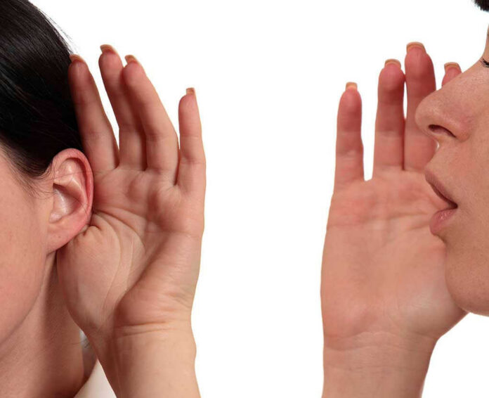 Person whispering into another persons ear gesture