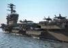 Aircraft carrier deck with jet planes.