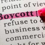 Highlighted definition of the word 'boycott' in a dictionary