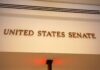 BRUTAL Senate Takedown: “You Disgust Me” Sign displaying United States Senate in a government building