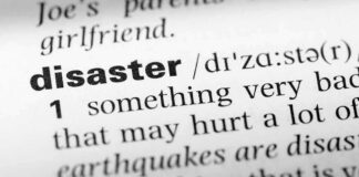 Close-up of a dictionary page showing the definition of the word 'disaster'