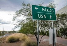 Road sign indicating directions to Mexico and the USA