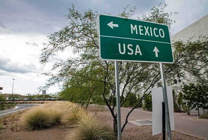 shutterstock_486345745 (2) (1).jpg Road sign indicating directions to Mexico and the USA