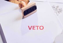A stamp with the word 'VETO' in red ink on a white document