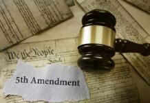 “I Plead The Fifth” Stuns Congress A gavel resting on legal documents with the text 5th Amendment