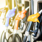 EPA JUST HAMMERED Skyrocketing Gas Colorful gas pump nozzles at a station.
