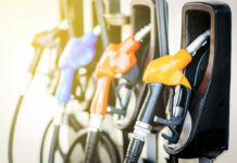 Colorful gas pump nozzles at a station.