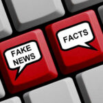 Keyboard keys labeled Fake News and Facts.