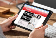 FELONY CHARGES–$22M Kickback Scandal EXPOSED Person reading news headline Scandal Unfolds on tablet